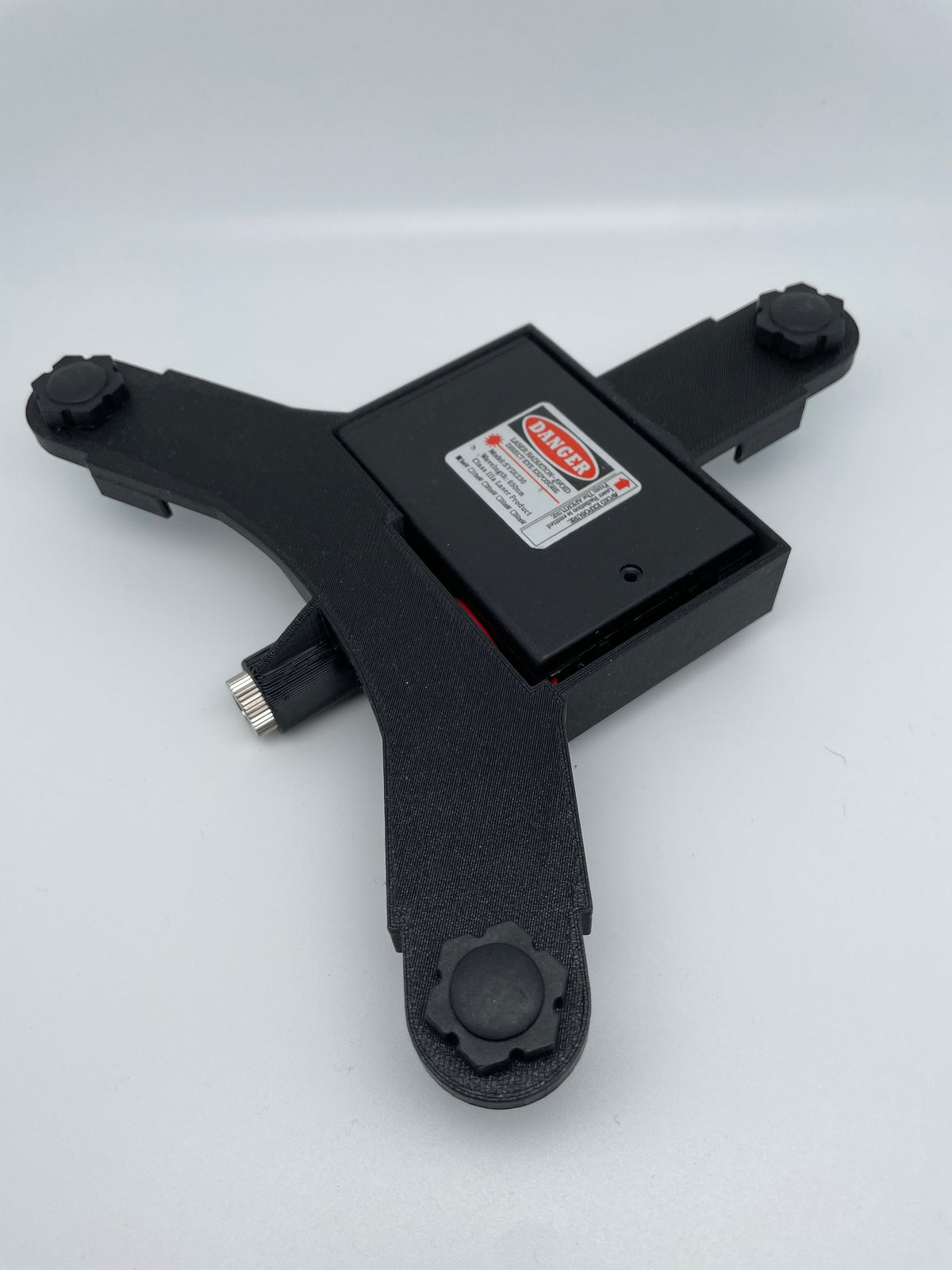 Underside of Garmin R10 laser stand with closed battery cover