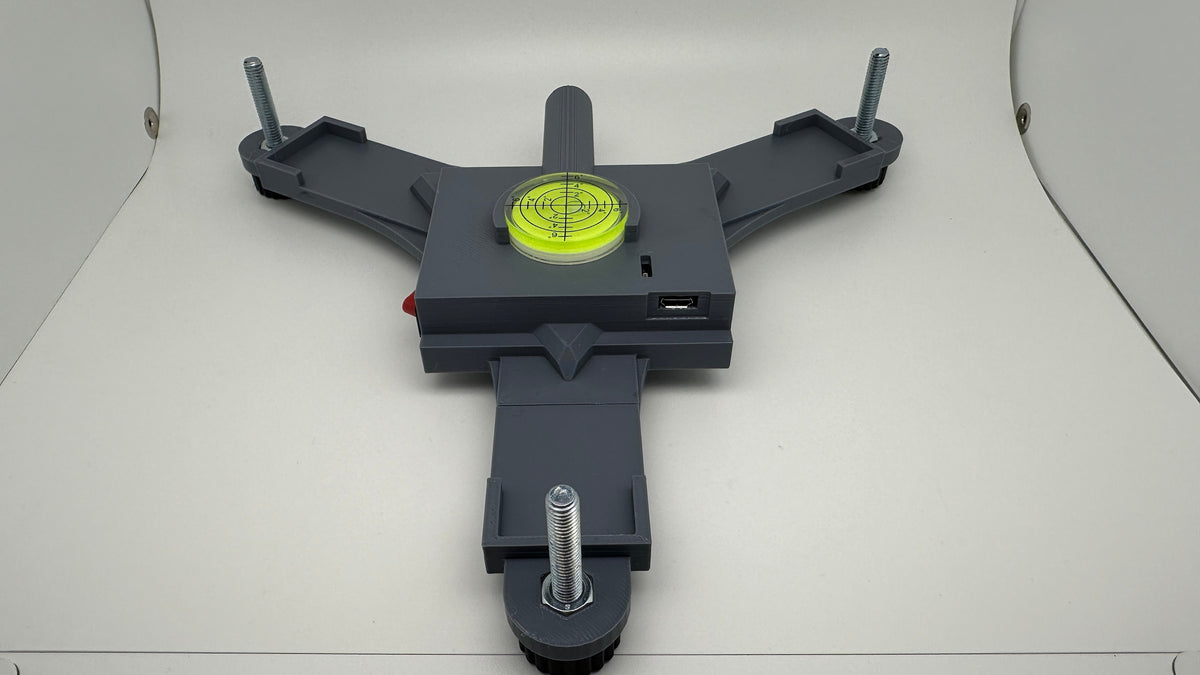 Printed example of the Rapsodo MLM2PRO rechargeable stand with yellow bubble level
