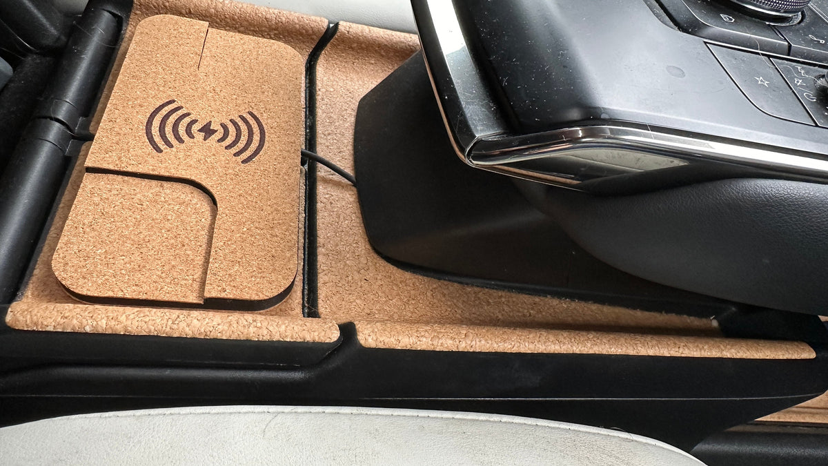 Cork-finished wireless charger fitted beside the Mazda MX-30 gear selector