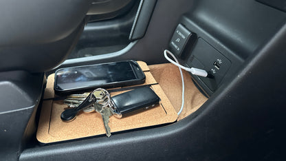 Mazda MX-30 dual console charger shown with a phone and keys