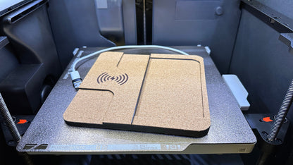 Close-up of the single charger on the printer build plate