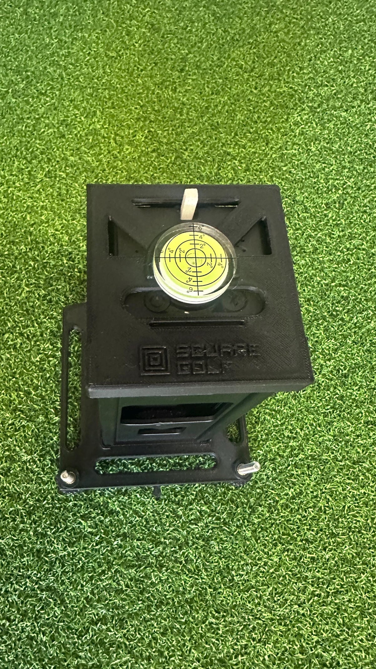 Top view of the original Square Golf metal case and bubble level