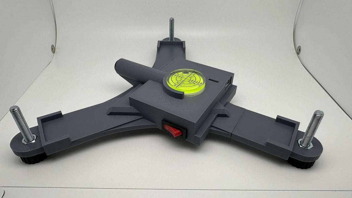 Side view of a printed Rapsodo MLM2PRO rechargeable stand with power switch