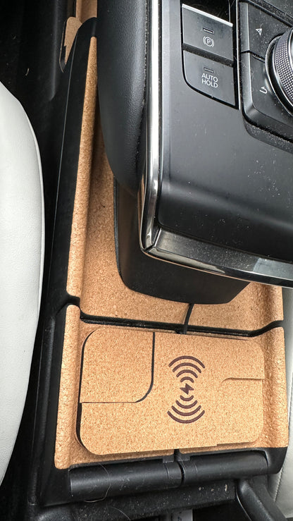 Overhead view of the charger fitted in the Mazda MX-30 cup holder area